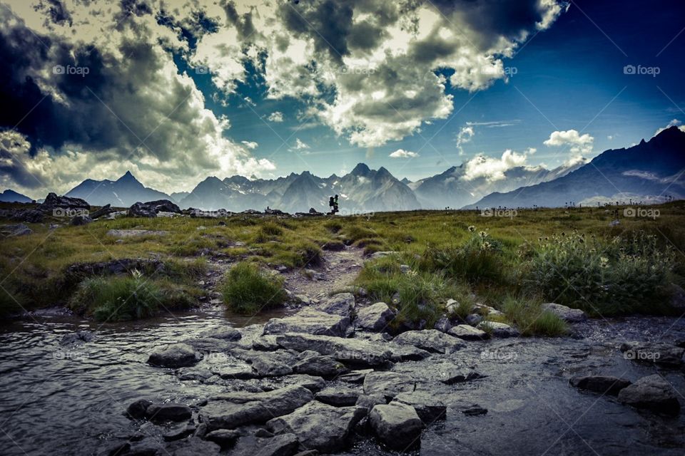 mountain landscape with hiker.