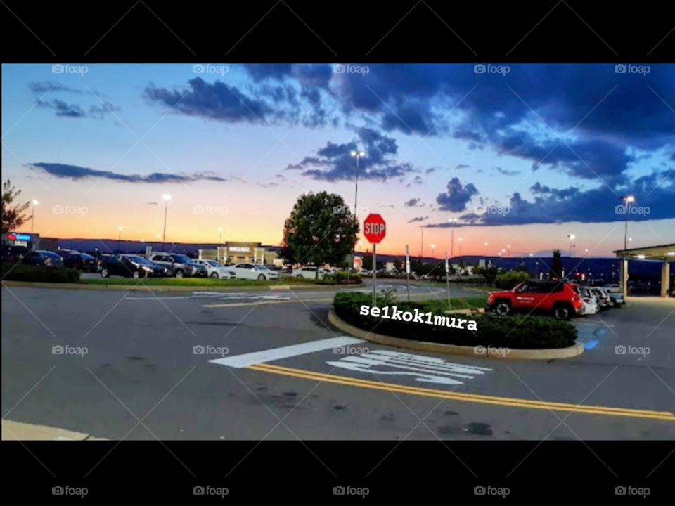 The sun setting over a shopping circle near my house a little while back.