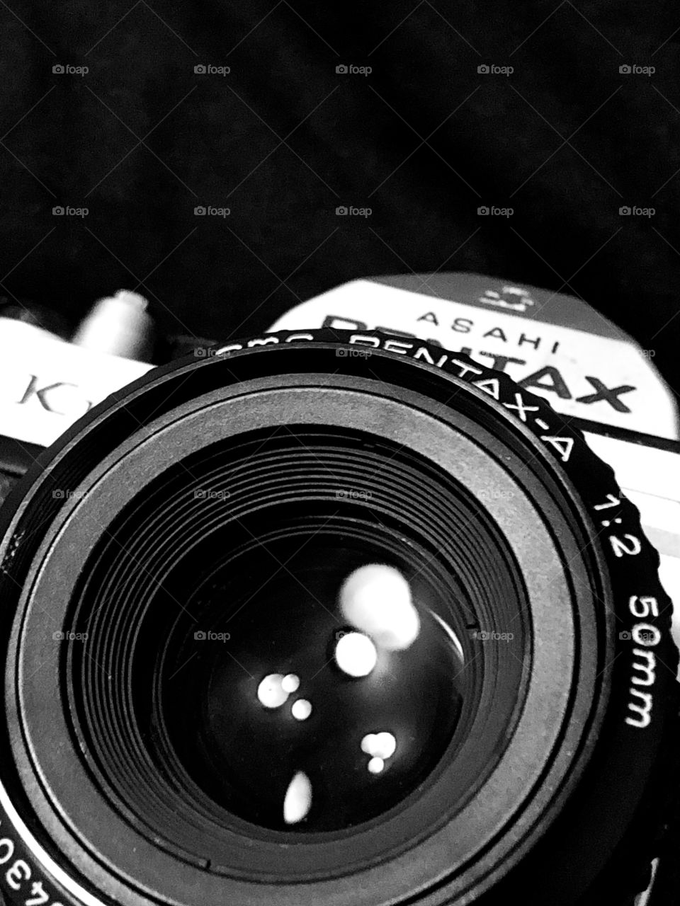 Pentax k1000 manual film camera; black and white photo