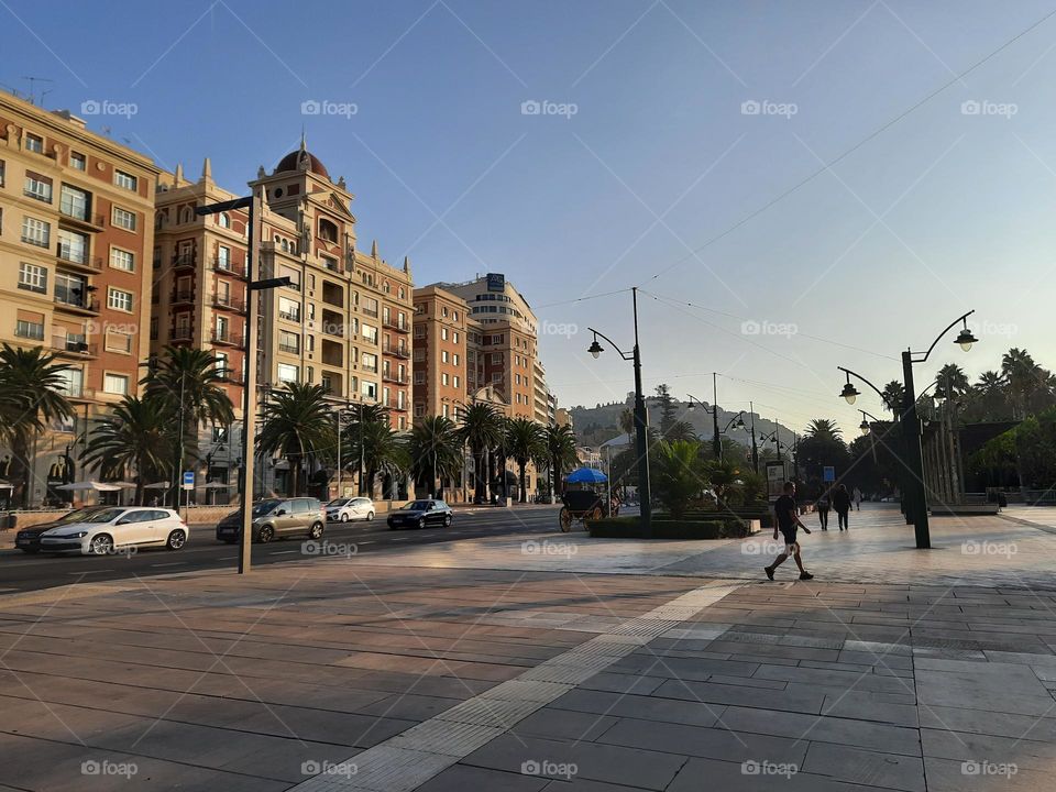 people go to work in the morning, Big hotel in the background