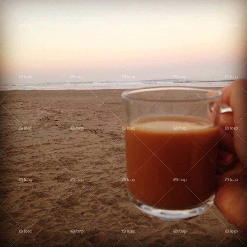 Coffee in the beach at sunrise.