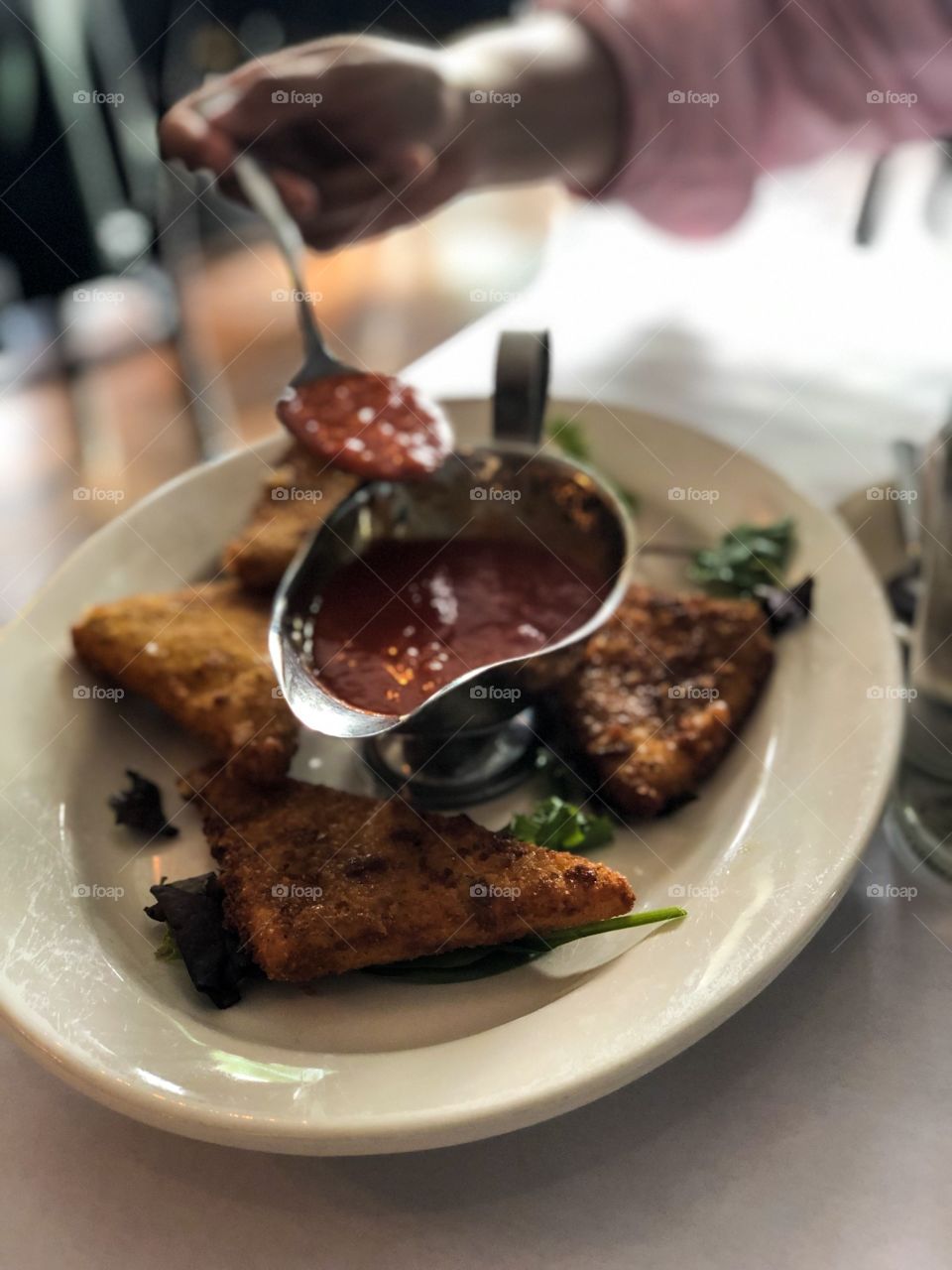 Fried Mozzarella Cheese With Marinara Sauce, Woman Eating, Spoon And Platter, Restaurant Style, Family Style Eating, Delicious Food Photography 