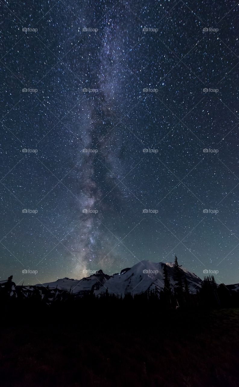 Majestic Milky Way shines over Mount Rainier as mountaineers start their summit push 