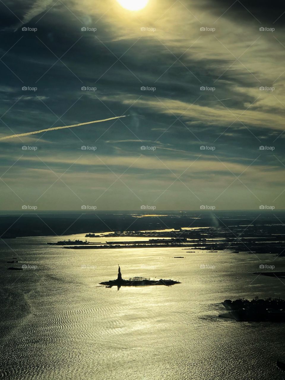 Statue of Liberty, on Liberty Island, seen from the One World Observatory, in a winter afternoon.