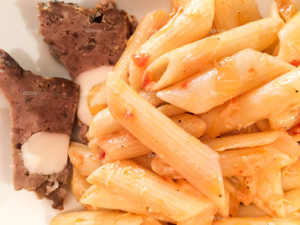 Penne Pasta Macaroni With Tomato Sauce And Meatloaf In A Plate
