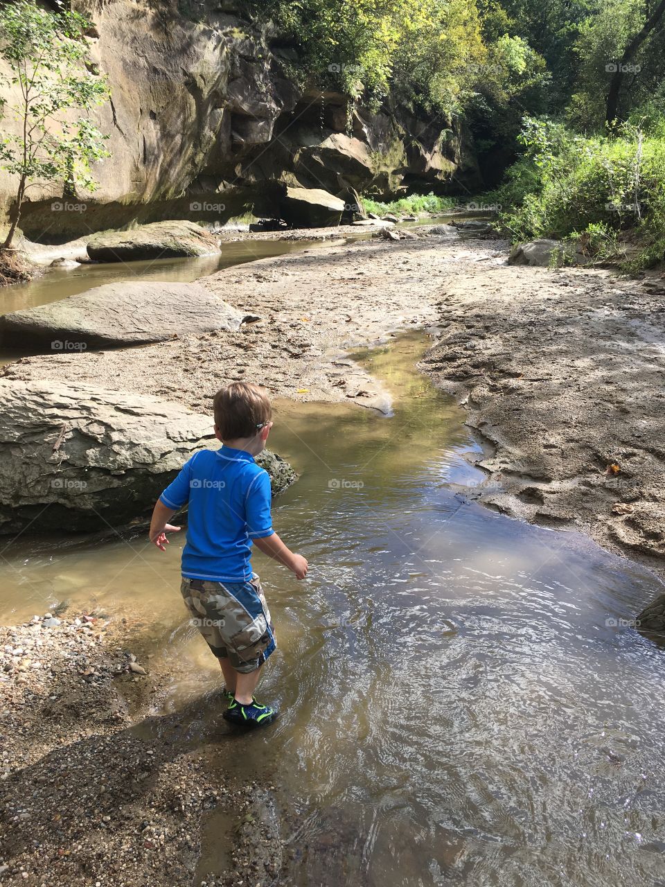 Boy running in the river