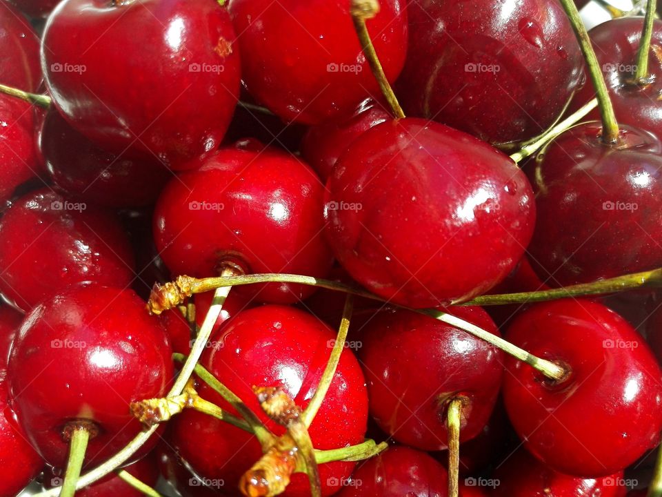 Background with red delicious cherries