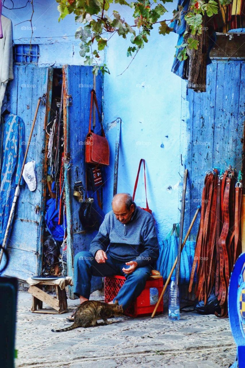 I took this one in the beautiful city of Chefchaouen situated in the north of Morocco. You can see this man feeding a cat ❤❤