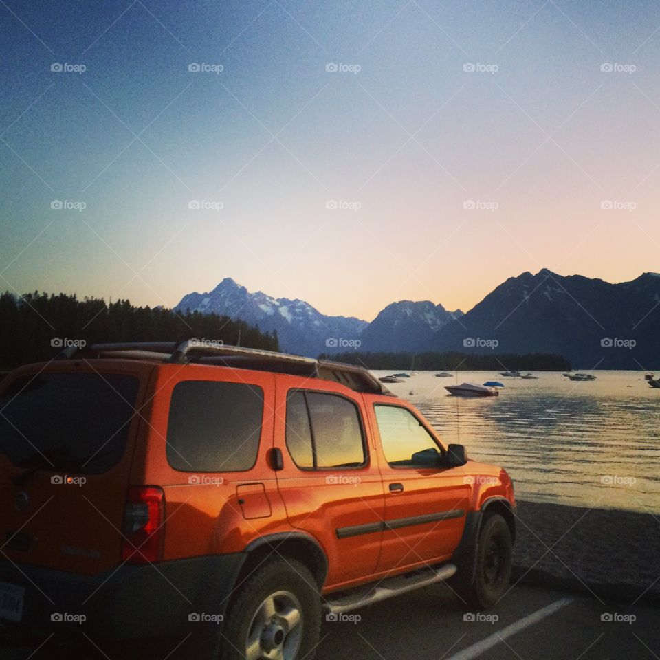 Xterra sunset. On a cross country road trip, we drove through the Grand Tetons and pulled off at this beautiful lake.
