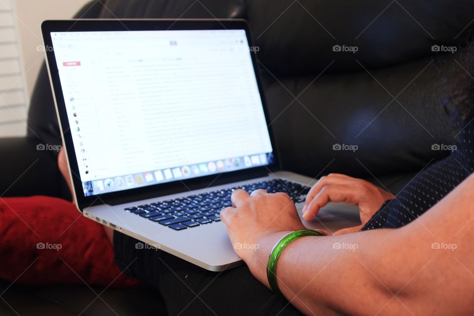 handy woman using laptop while working from home 