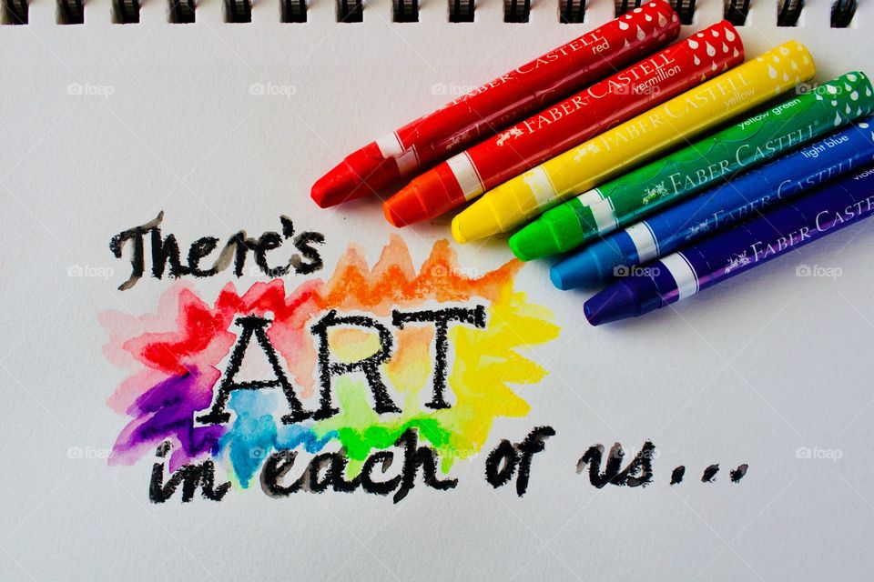 Colours of the World - watercolor crayons on mixed-media wire-bound paper next to watercolor-crayon-embellished phrase “There’s art in each of us...”