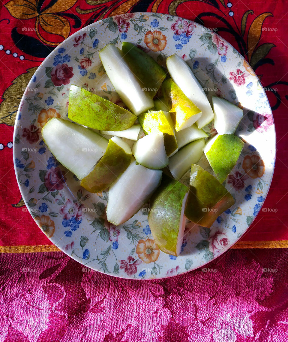 Freshly cut conference pear in sunshine