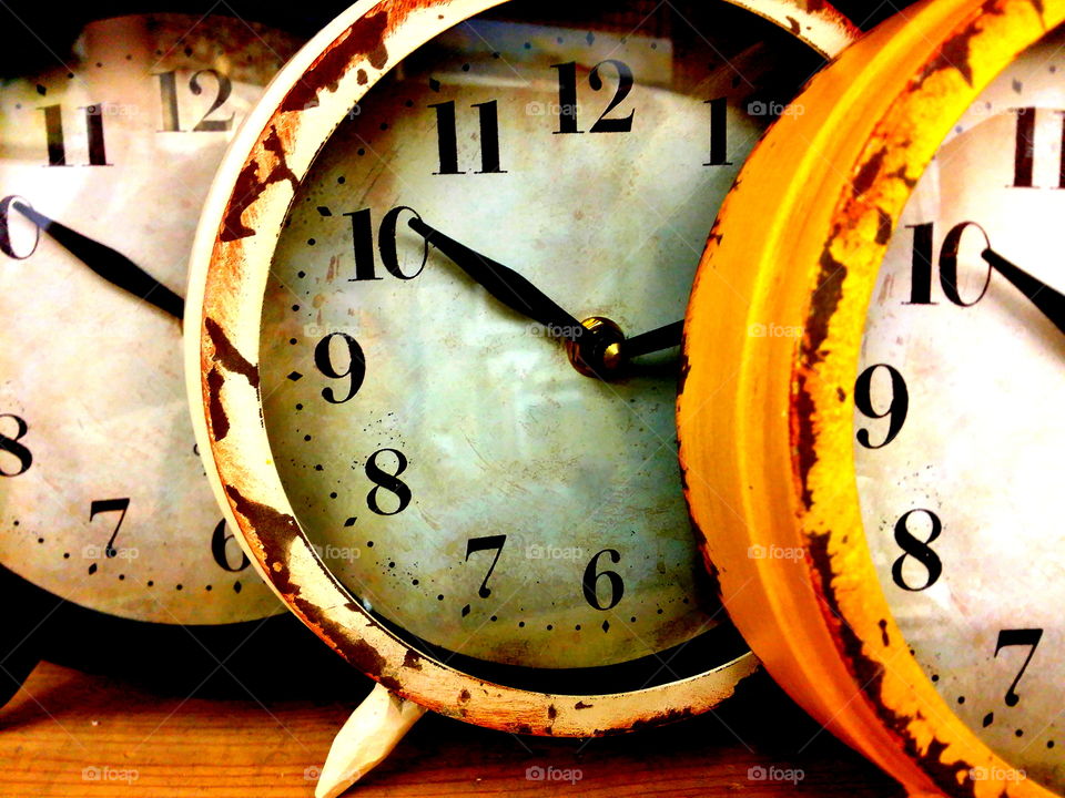 Close-up of rusty clocks
