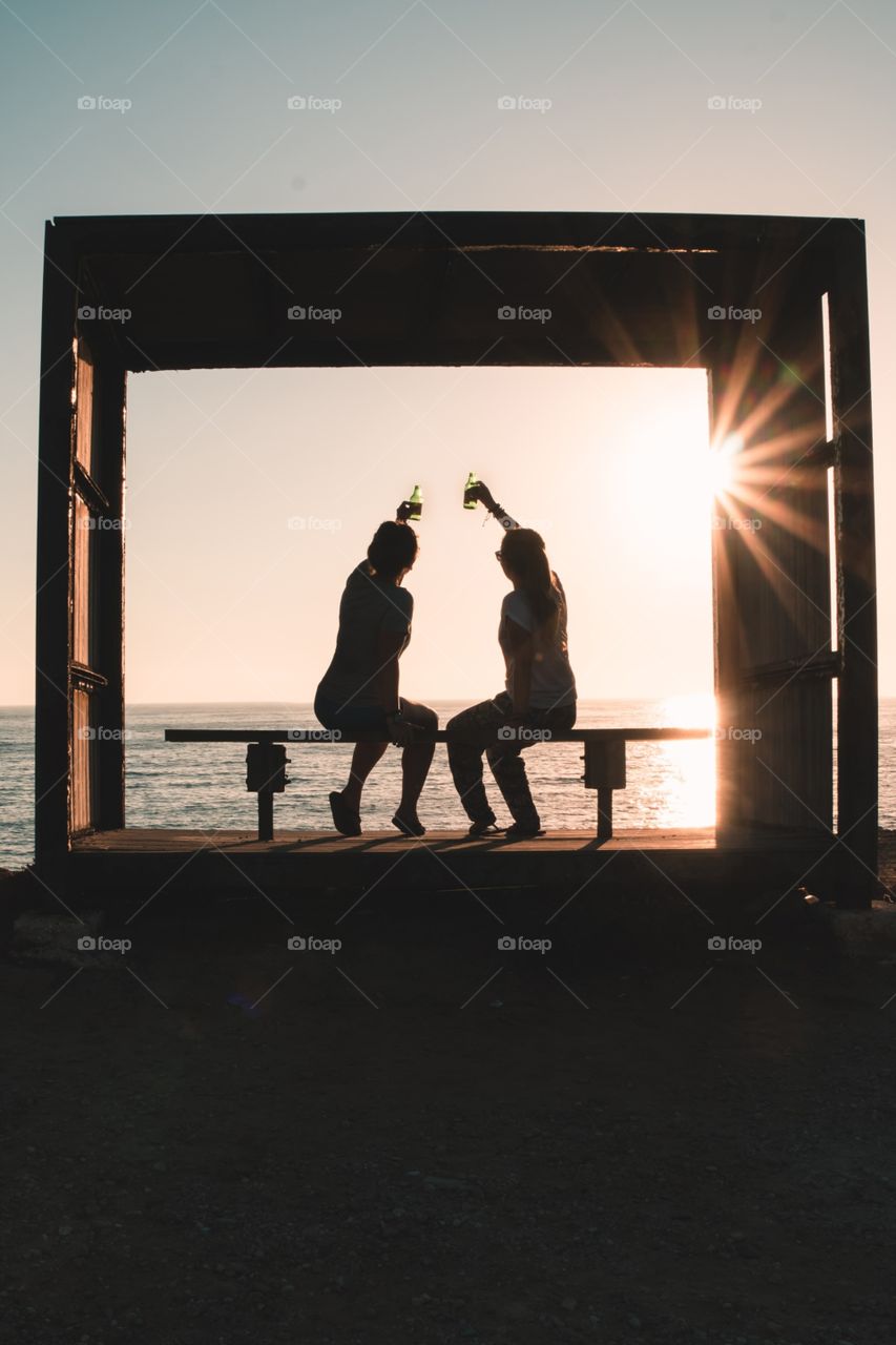 Two girls enjoying summer time. Cheers!