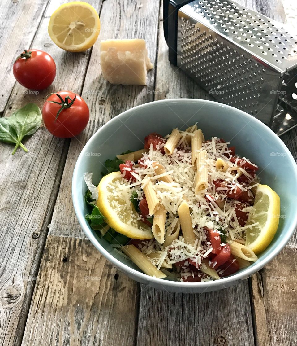 High angle view of pasta with chesse grater