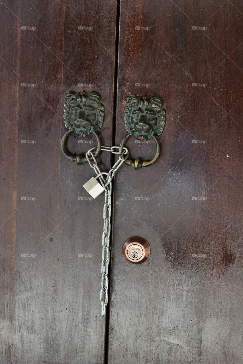 Old door with round metal knobs for exterior design. Antique and grunge style.
