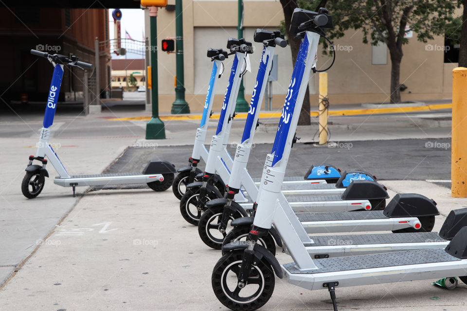 Row of city scooters downtown