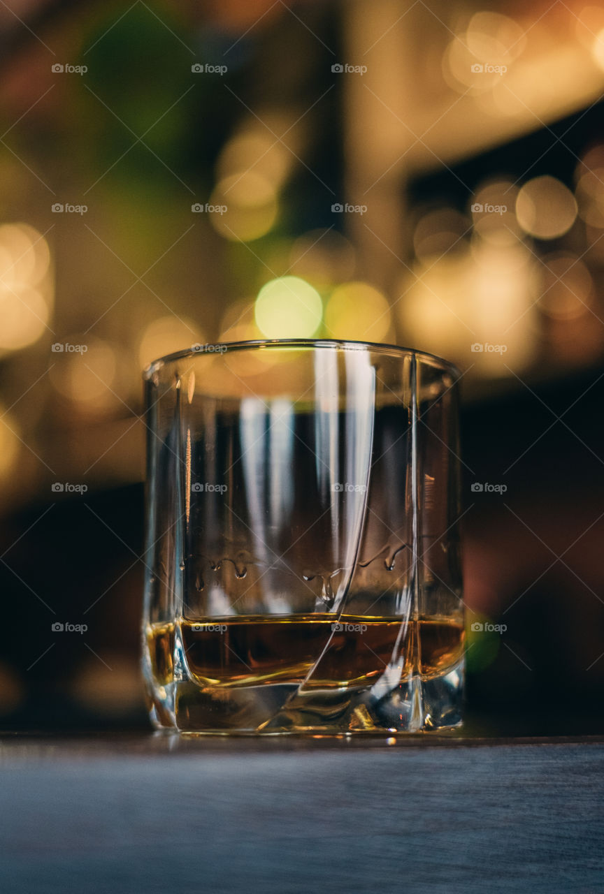 Glass of whiskey on the bar
