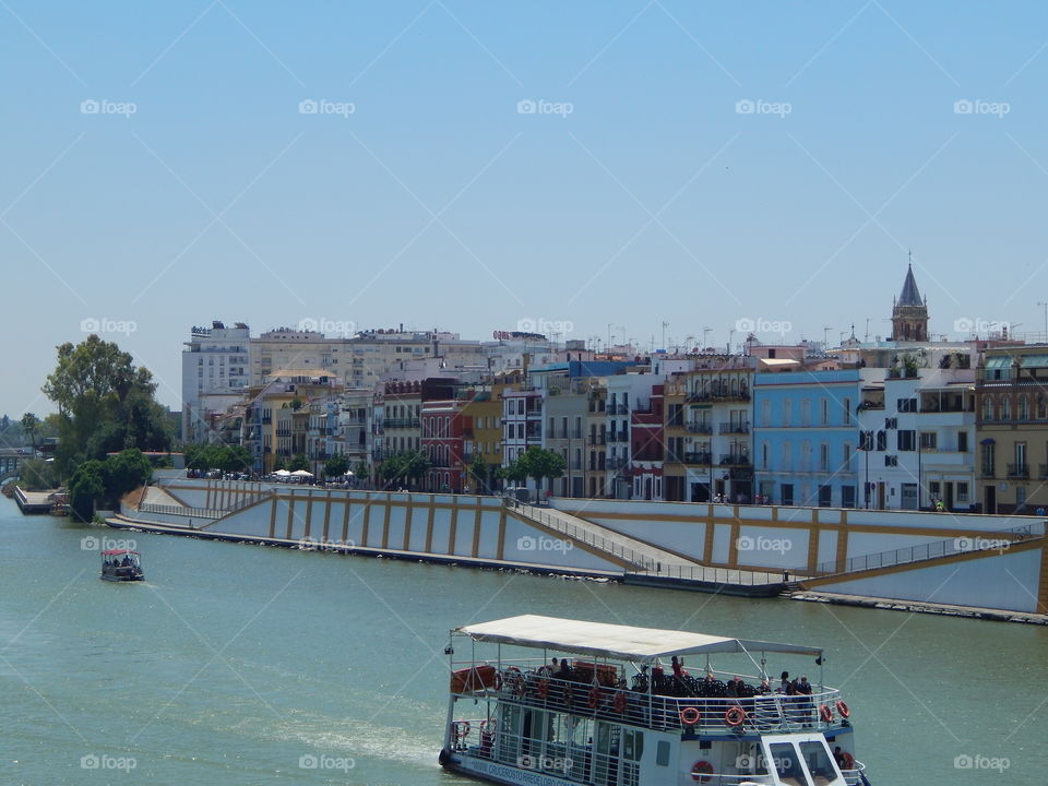Riverside with colorful houses in Sevilla, Spain 