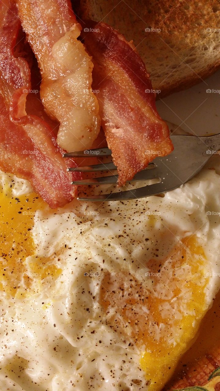 bacon over easy egg toast Fork