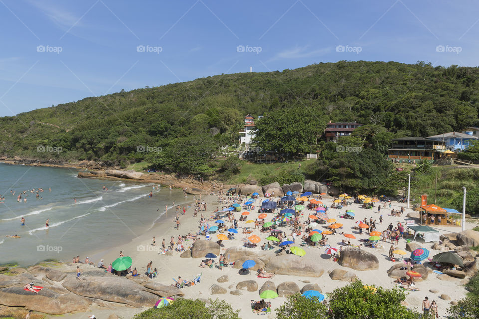 Tourists enjoy the summer on the little beach in Barra da Lagoa in Florianopolis Santa Catarina Brazil.