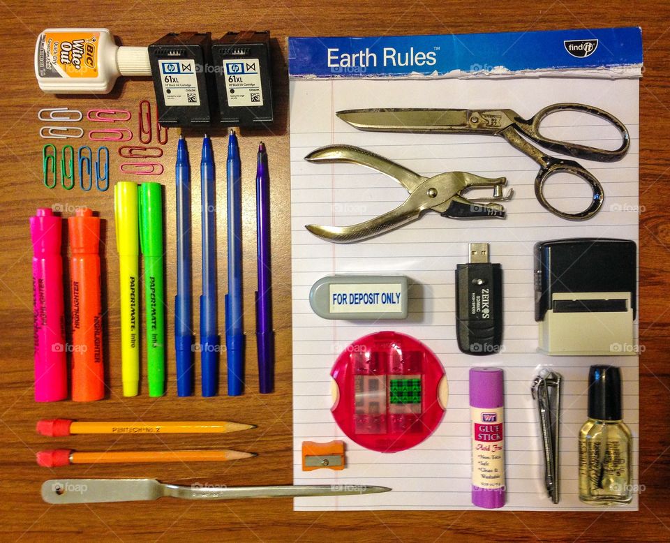 Desk clutter. Office supplies arranged on the desk