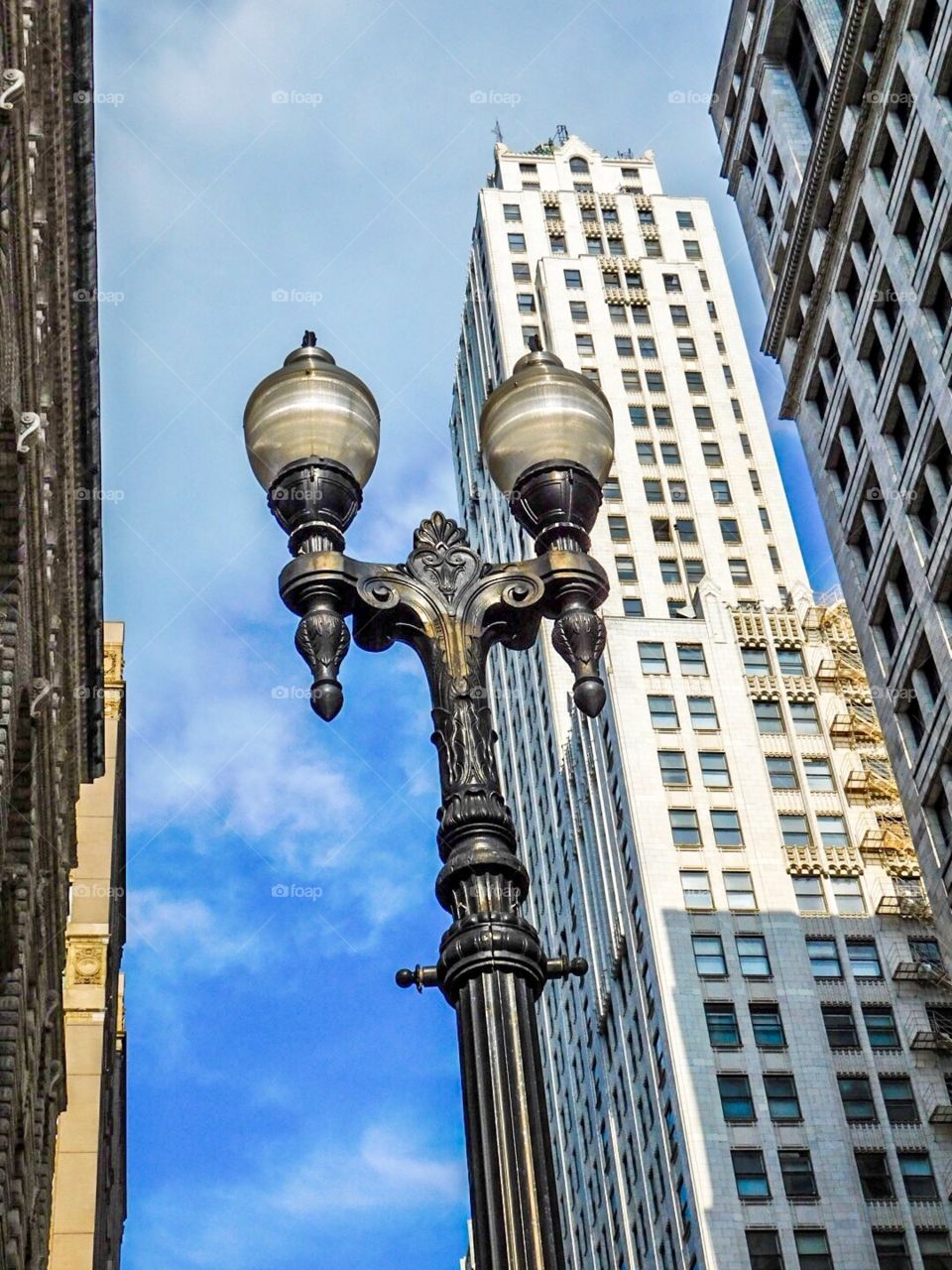 A street lamp with buildings in the background in Chicago 