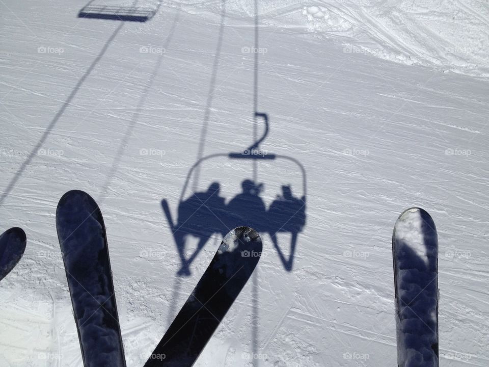 Ski lift. Shadows of skiers from lift