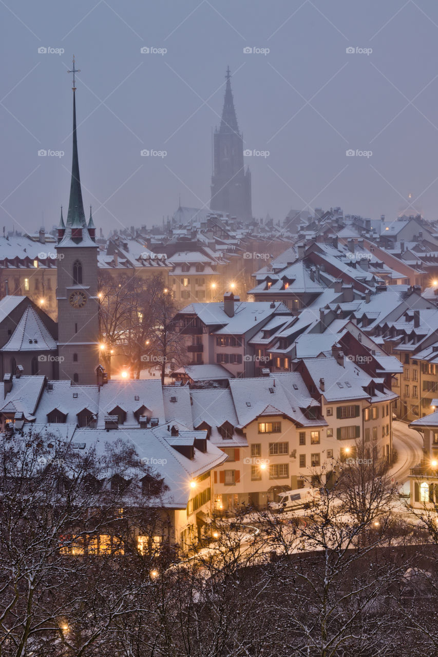 City lights of old town in bern during snow.