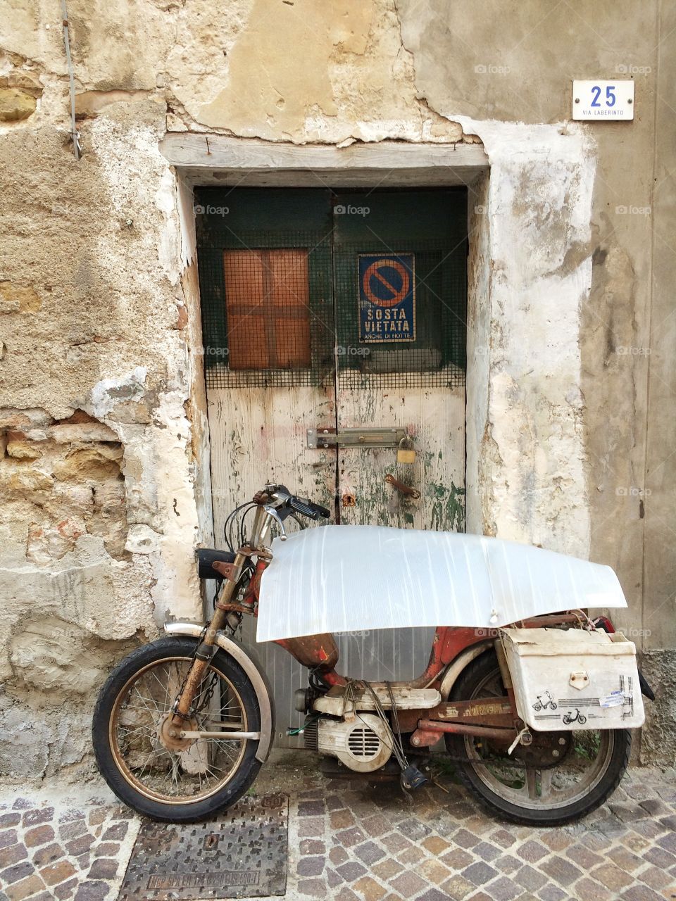 Motorbike front of a door