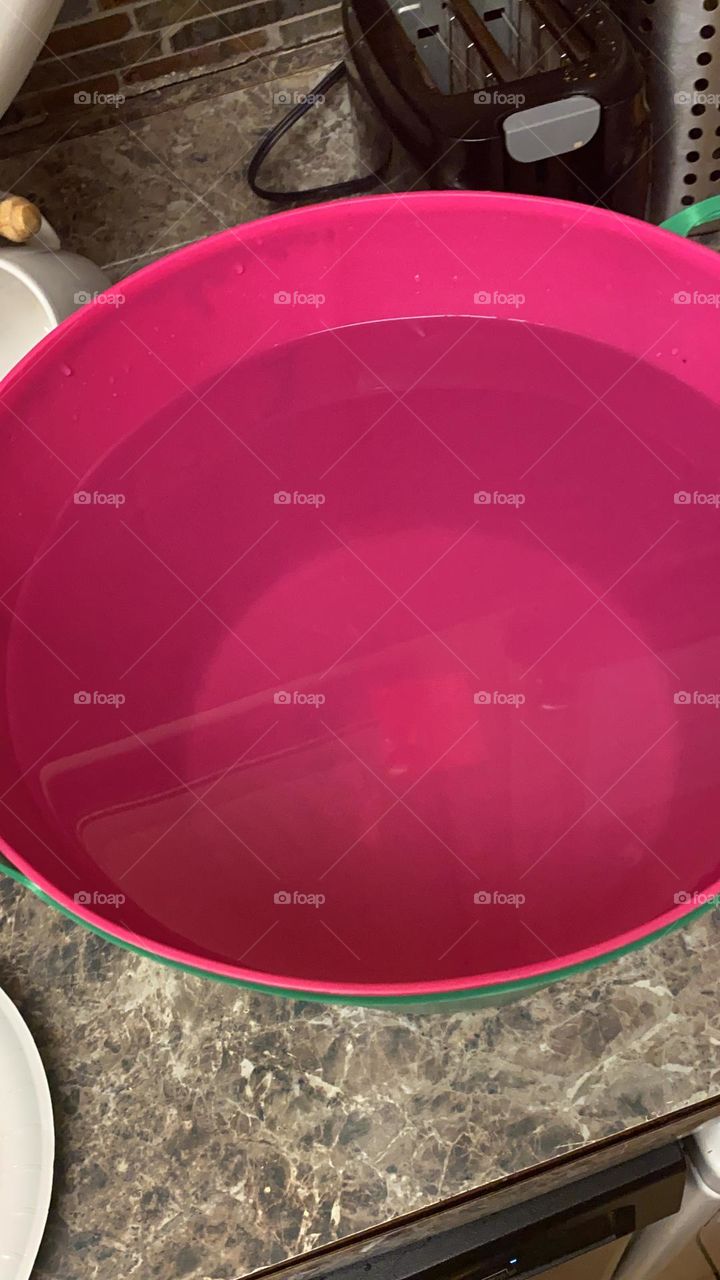 Pink bucket of water