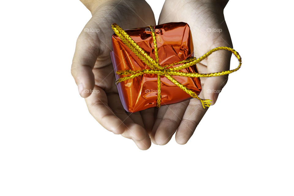 Isolated Hand holding Gift box red for the festivities on a white background.