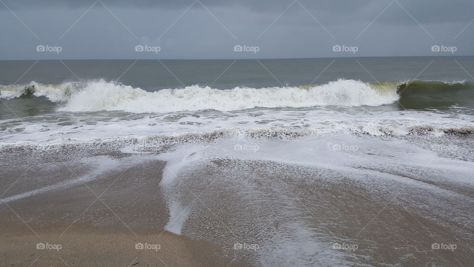 waves from tropical storm Bonnie crashing on Edisto Beach, South Carolina