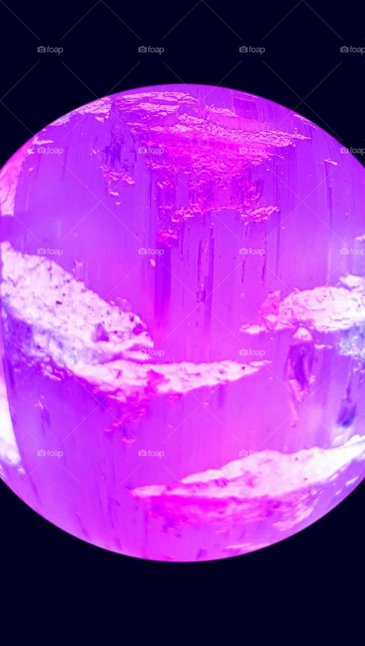 Selenite crystal purples and pinks with frosted edges. Beautiful colorful creation. noticing the detail within if you look close see the grain. created a new world.