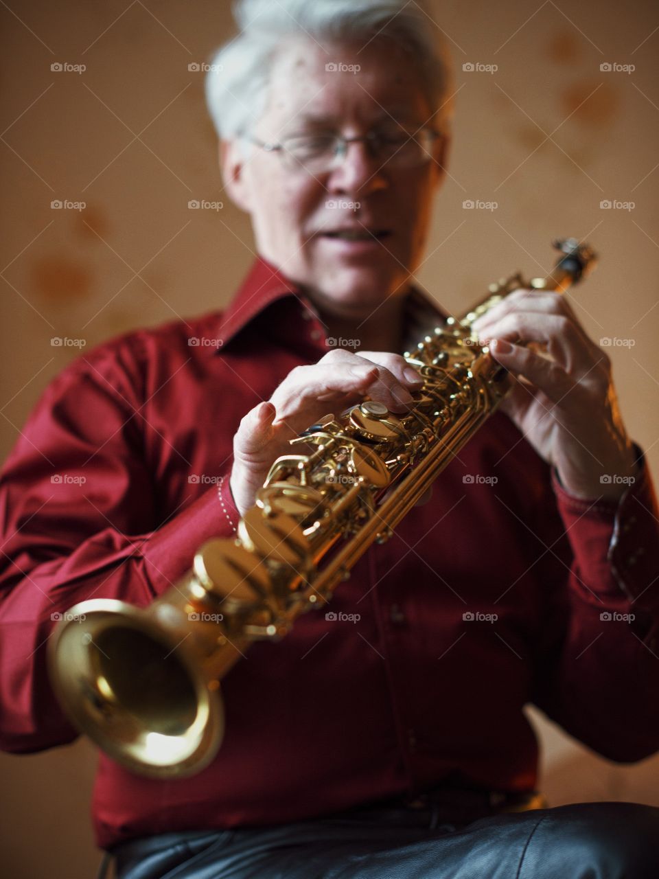 Senior man playing saxophone