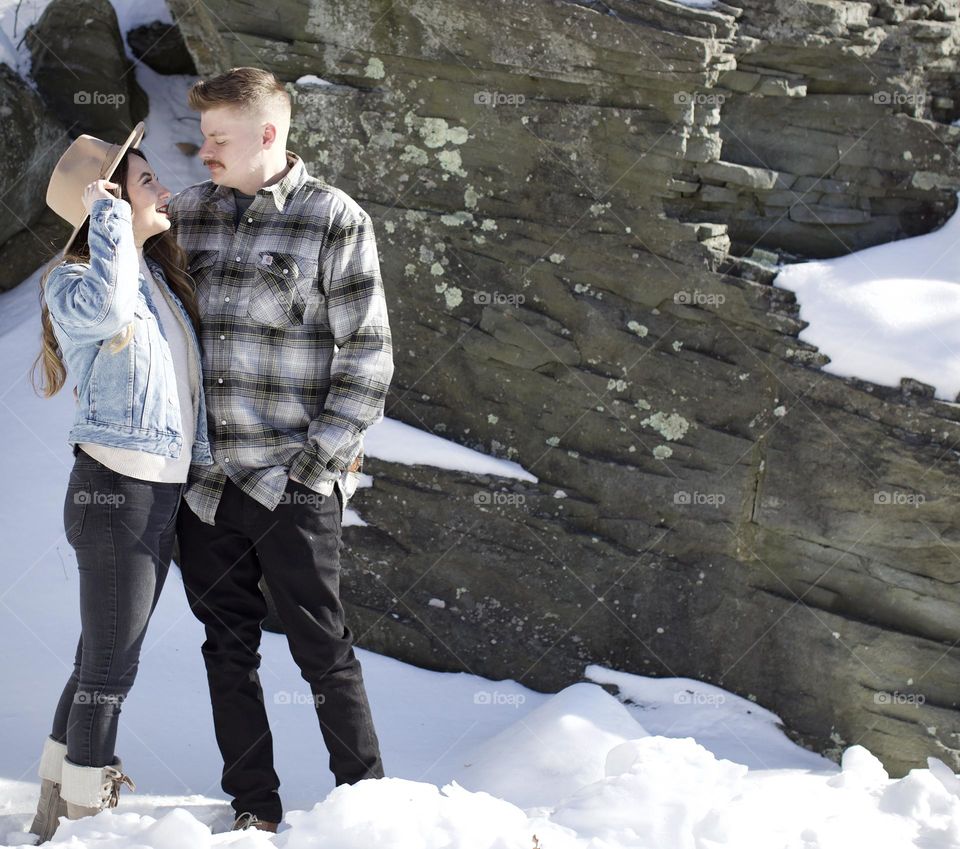 Couple in front of a rock face