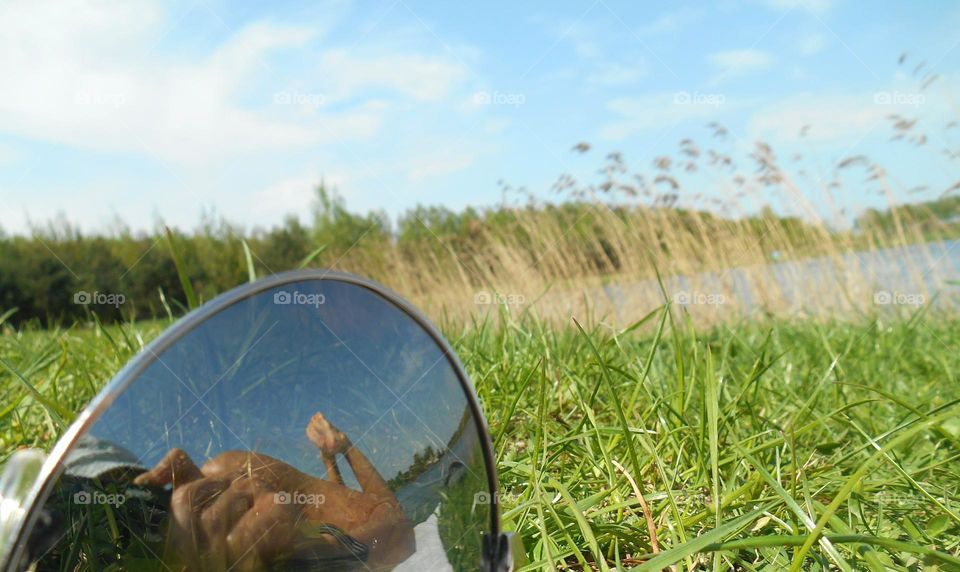 reflection female legs barefoot view from the ground