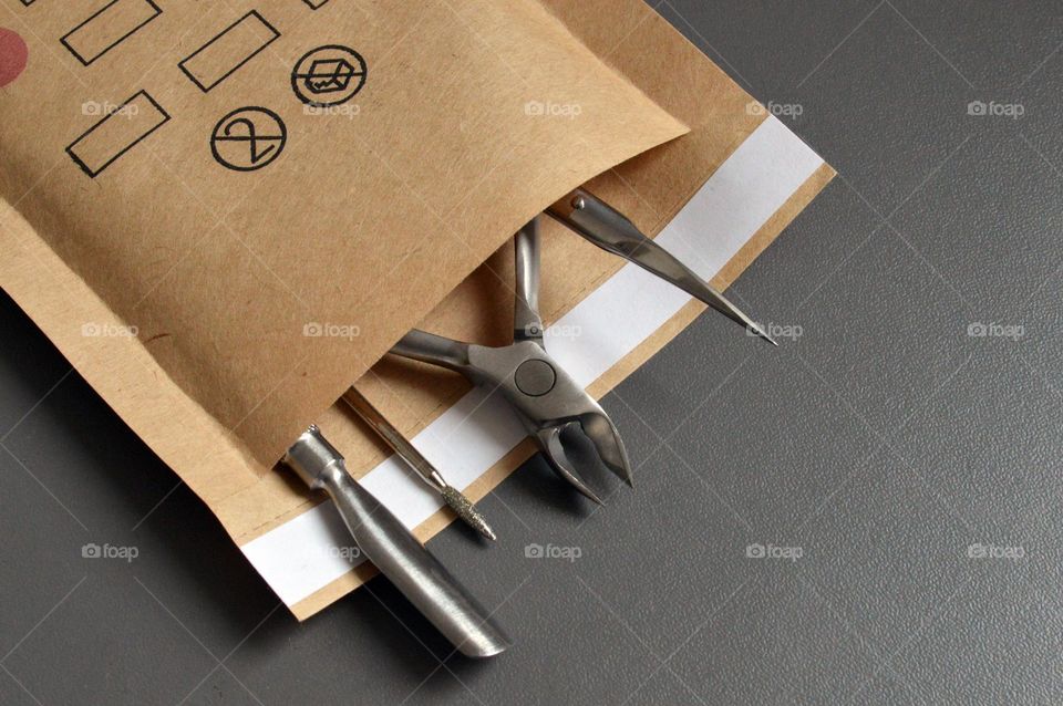 Manicure tools in a kraft bag for sterilization