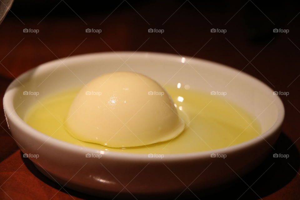 Sunny side-up cooked egg ? Nah , delicious cream dessert.