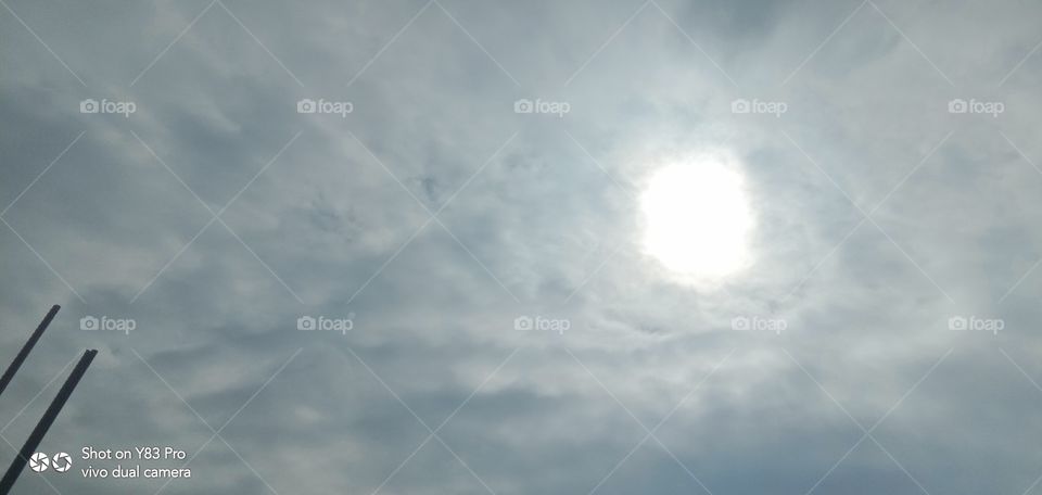 sun hidden in sky