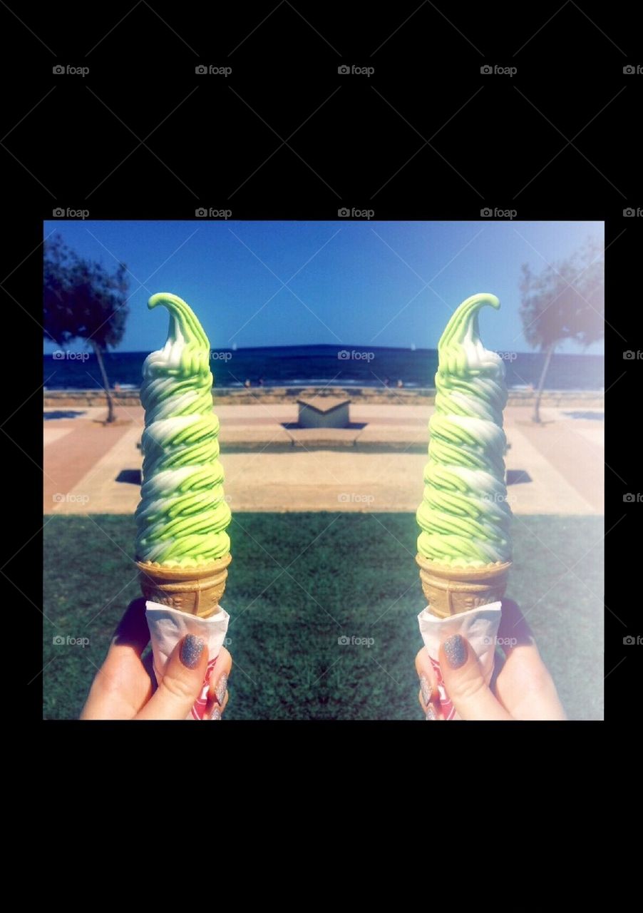 Ice cream swirl by the beach reflection