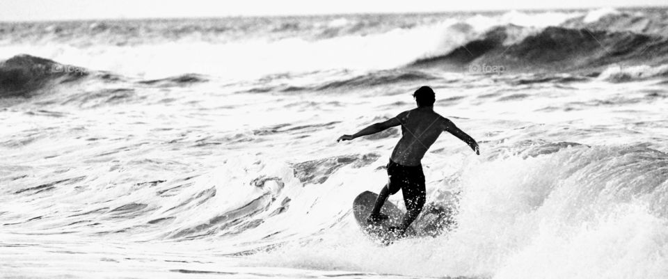 Surfer in the waves Black and White