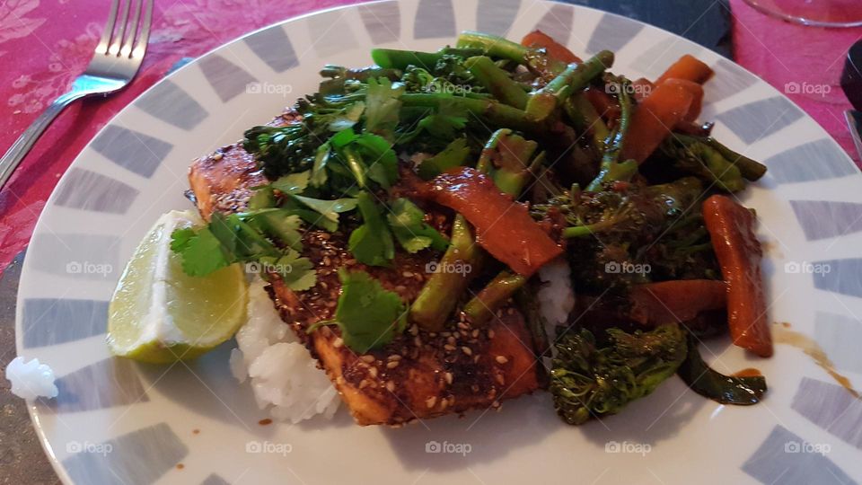 Seafood dish with stir fried vegetables and coriander