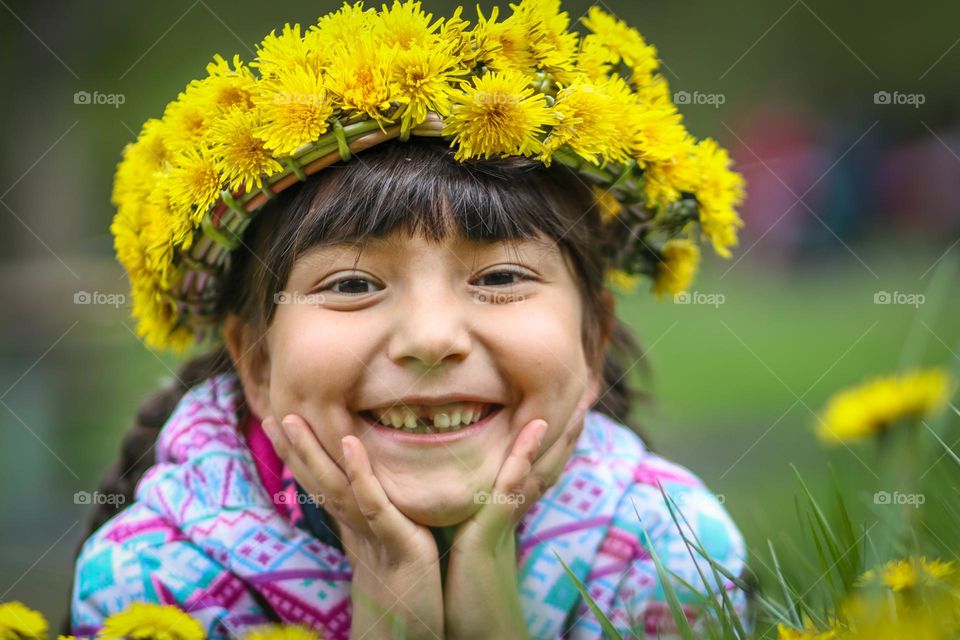 Smiling girl with dandelion crown