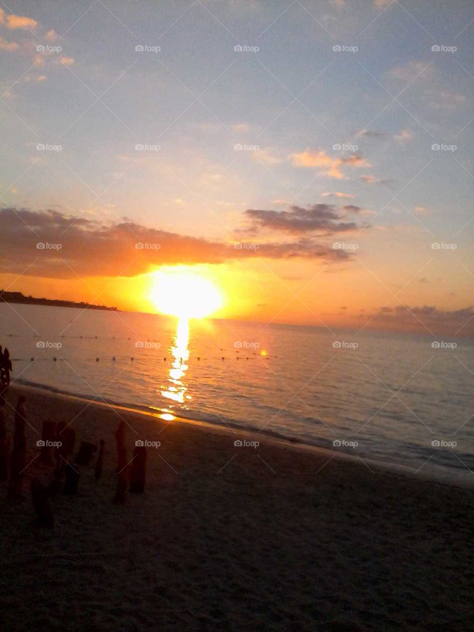 embrace this beautiful an breath taking picture this is one of the most beautiful sunset you will ever see .