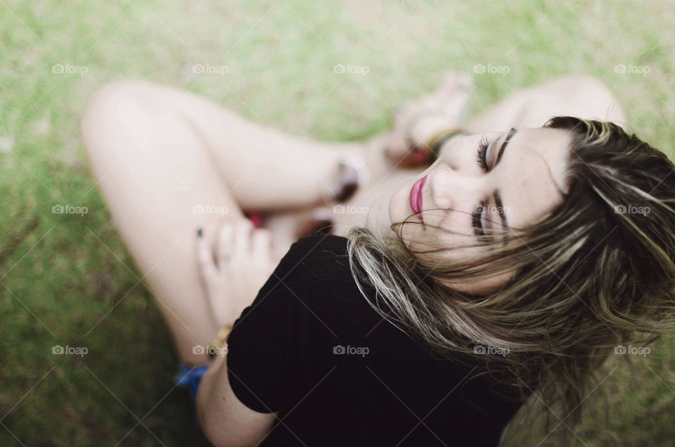 Woman sitting on grass