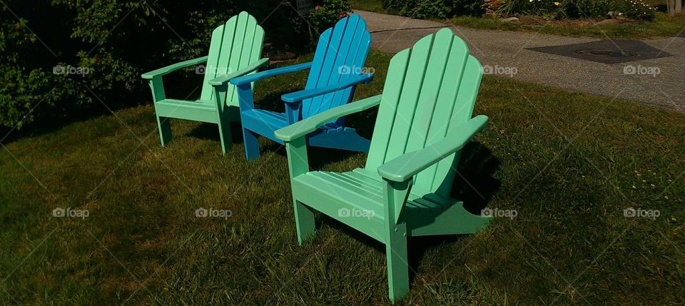 green and blue Adirondack chairs
