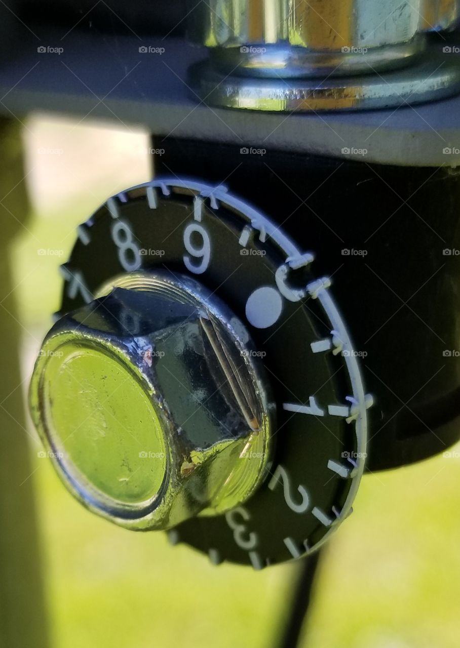 Dial found on the bottom of a satellite dish.