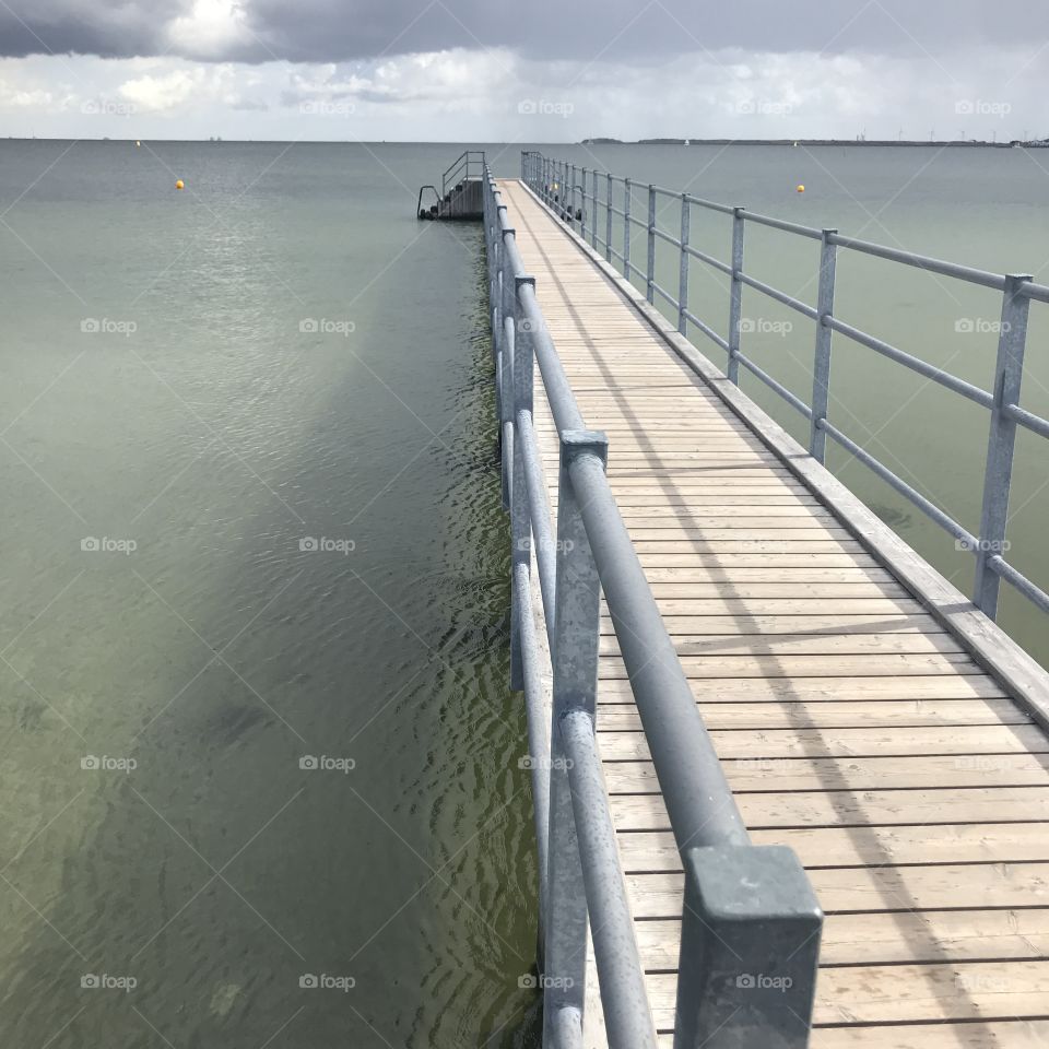 Wooden jetty going out into the sea