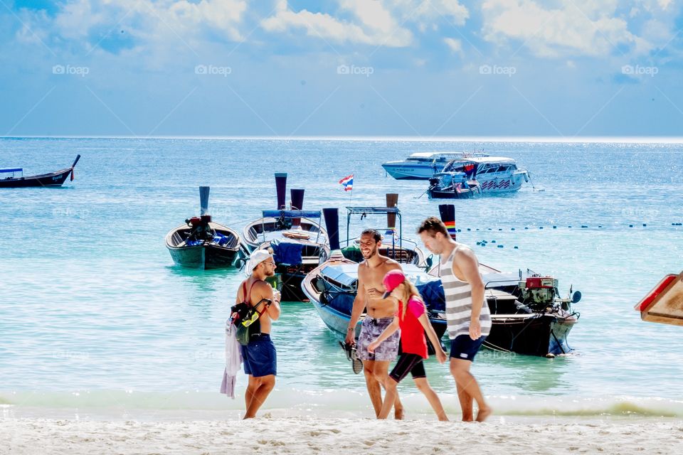 Family happy fun on the beautiful beach